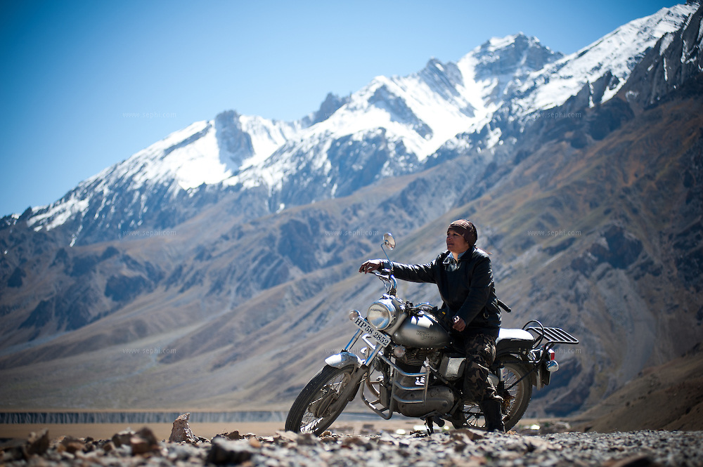 Scene from a group of motorcycle riders riding Royal Enfield bikes on a tour from Manali to Spiti in HImachal Pradesh